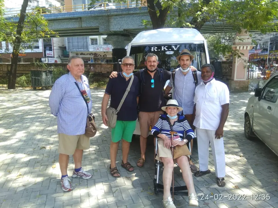 Our driver with an overseas group, including a guest in a wheelchair, before a city tour