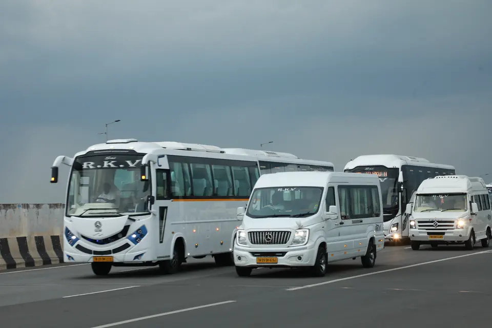 RKV buses and tempo travellers driving together on a highway near Chennai