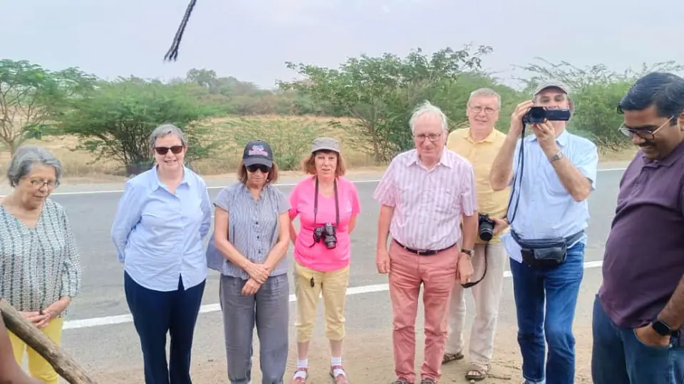 Senior overseas tourists standing on a roadside during a sightseeing trip