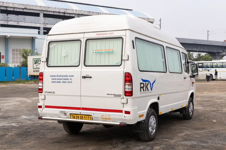 Rear view of an RKV-branded Force tempo traveller with emergency exit door